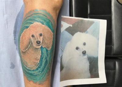 A person with a tattoo of a dog