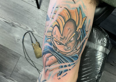 A person with a tattoo of goku