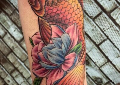 A fish with a flower on it's arm